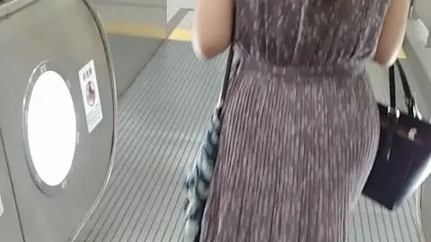 Asian Woman in Subway Station