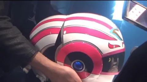 Asian cosplayer in metallic costume