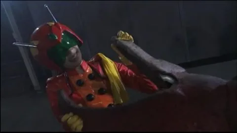 Asian Performers in Camouflage and Red Costume Scene