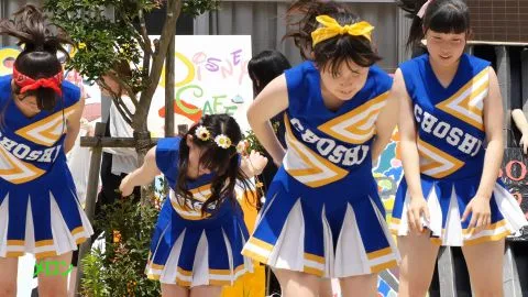 Asian Teen Cheerleaders Dancing Outdoor