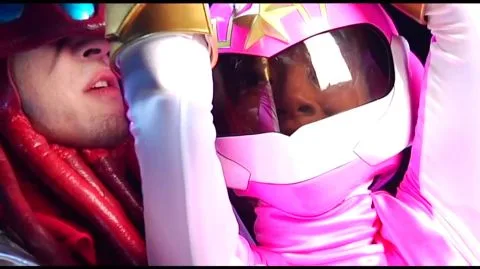 Men in Costumes and Helmets Intimate Encounter