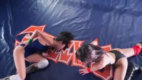 Asian Women Engage in Wrestling Match