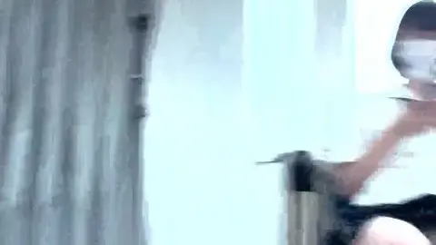 Asian Teen with White Mask on Train