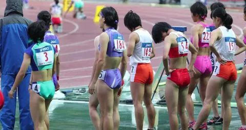 Asian Athletes in Erotic Action at Track Stadium