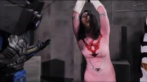 Asian Women in Pink Bodysuits Engaged in Explicit Acts