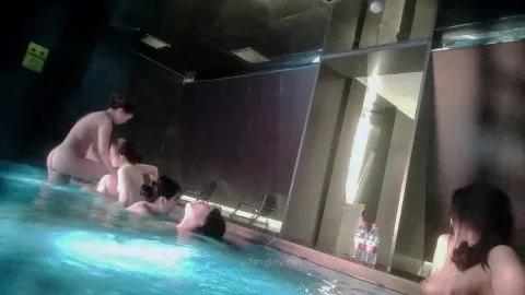 Asian Girls Bathing Together in Dimly Lit Bathroom