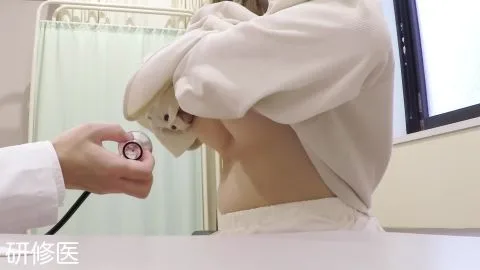 Asian Couple in Medical Room Examination