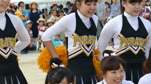 Asian Teen Cheerleaders with Pom-Poms