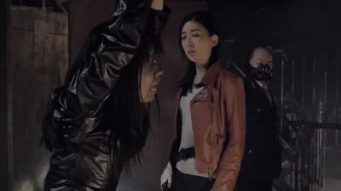 Asian Women in Leather Jackets in Dark Room
