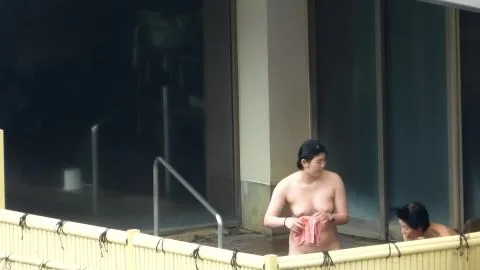 Asian Women in Bathroom with Bamboo Fence