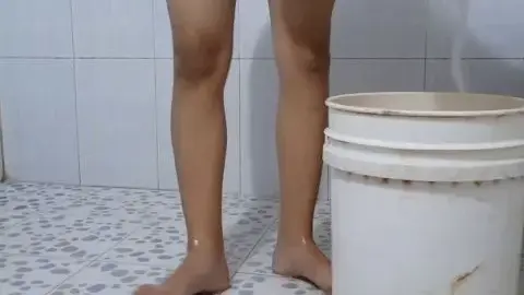 Woman washing face in shower