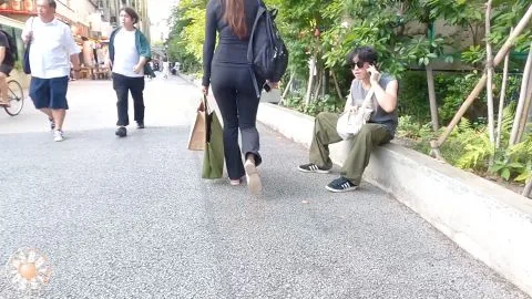 Asian Brunette Walking on Street
