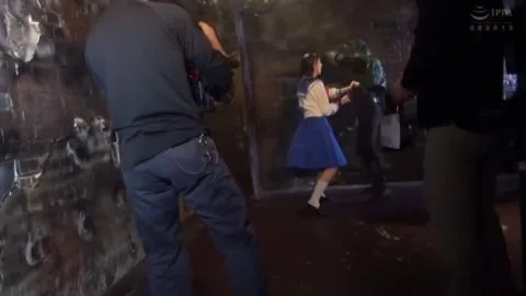 Asian Duo in Anime Costumes Engage in Industrial Setting