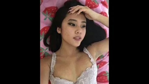 Asian Girl Pleasuring Herself in Bedroom