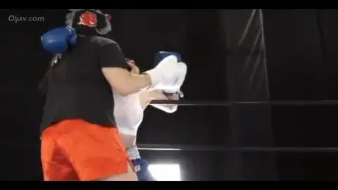 Asian Boxers Engage in Intense Match