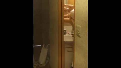 Asian Couple Kissing in Bedroom