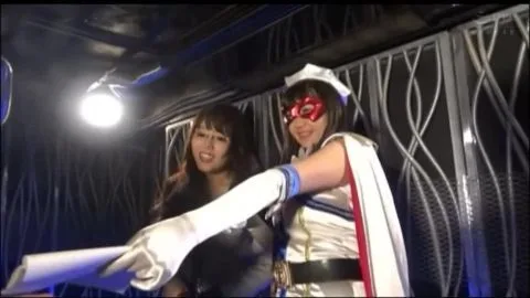 Asian Duo in Costumes Pose on Stage