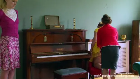 Three Women Engage in Spanking in Living Room