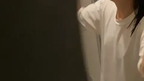 Asian Girl Washing Face in Bathroom