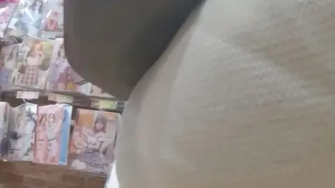 Asian Teen Shows Off in Clothing Store