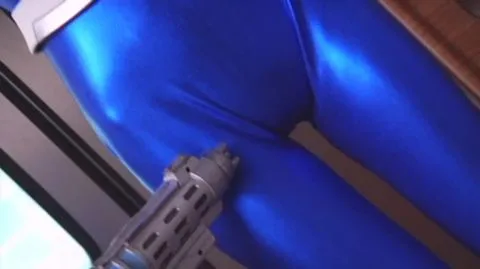 Asian Woman in Latex and Guns