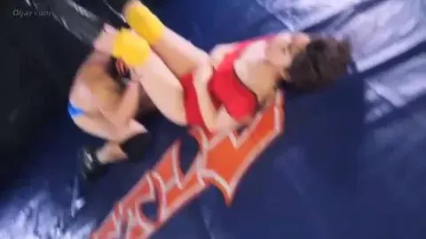 Asian Wrestlers in Red Dress Wrestling Match