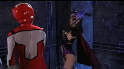 Asian Women in Masks and Costumes Engage in Intimate Encounter