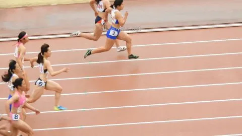 Asian Athletes Running Track