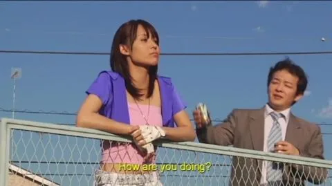 Asian Couple in Costumes Outdoors