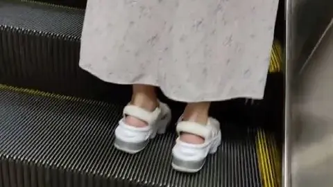Asian Teen on Subway Escalator