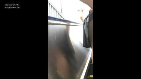 Asian Teen in School Uniform on Escalator