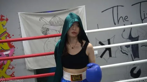 Asian Girl Grapples in Boxing Ring