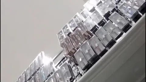 Asian Women Trying On Clothes in Store