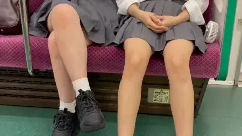 Schoolgirls on Train Intimate Moment