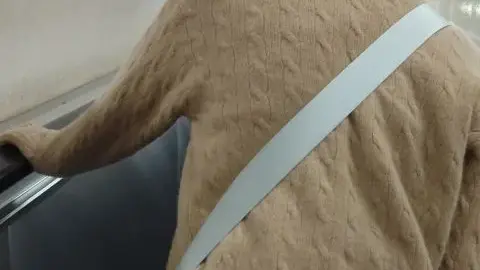 Asian Teen in School Uniform on Escalator