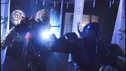 Asian Men in Costumes Engage in Intense Action