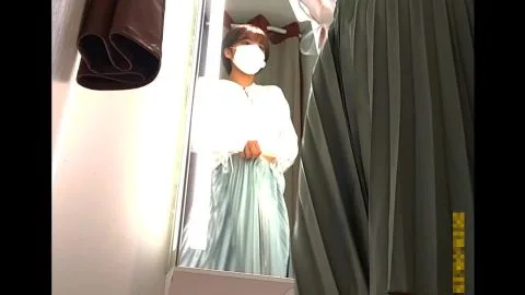Asian Girl Tries On Clothes in Dressing Room