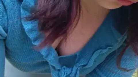 Asian girl in blue top outdoors