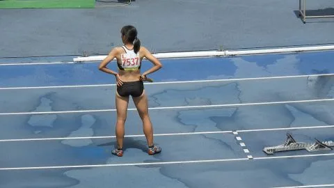 Asian Athletes Running Track