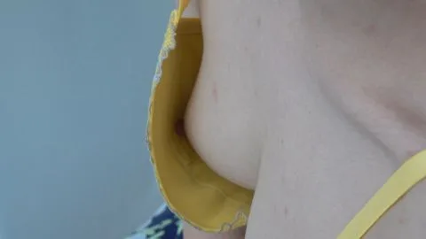 Asian Woman in Yellow Bra and Face Mask