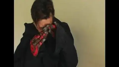 Asian Schoolgirls Kissing in Classroom