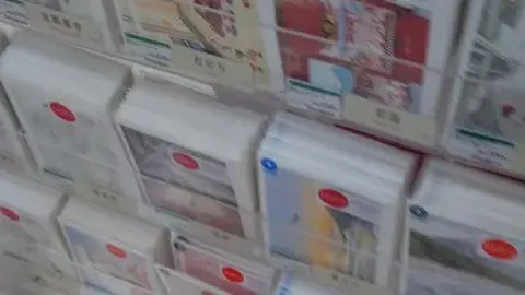 Asian Woman in Card Store