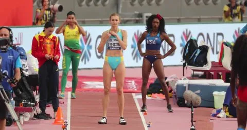 Athletic Women in Sports Attire at Indoor Track