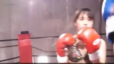 Asian Women Boxing in Ring