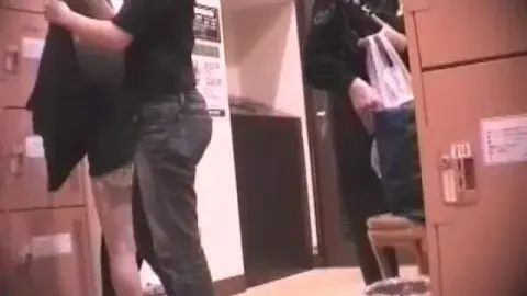 Asian Couples Changing Clothes in Locker Room