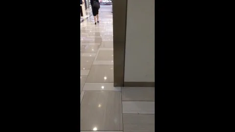 Asian Woman in Black Dress at Mall