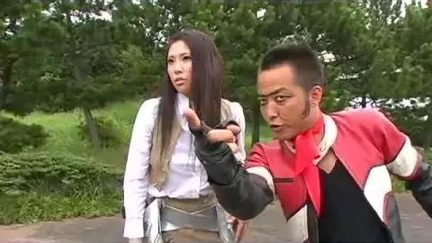 Asian Cosplay Lovers Embracing and Kissing