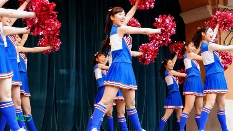 Asian Teen Cheerleaders Perform Routine