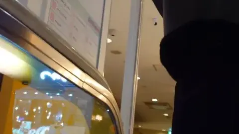 Asian Teen in Black Boots at Shopping Mall