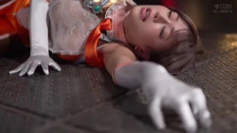 Captive Brunette in Orange Costume